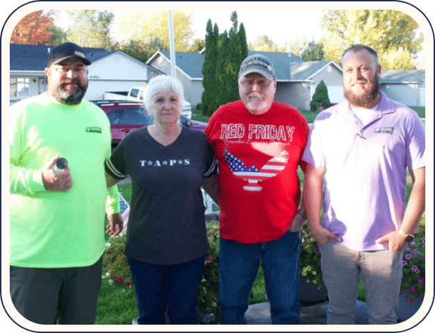 Greens Heating and AC team posing with local residents of the Canyon County area; Jim and Marie.